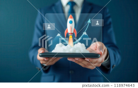 Business rocket growth concept with rocket launch graphic on tablet, symbolizing startup success, rapid income increase, and upward financial trends in corporate strategy Business rocket growth concept with rocket launch graphic on tablet, symbolizing startup success, rapid income increase, and upward financial trends in corporate strategy 118974643