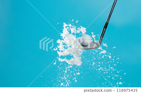 Golf Ball golfer hit snow to explode and splatter. Sand wedge golf dick ball from snow field and snow fly in air. Blue sky background isolated Golf Ball golfer hit snow to explode and splatter. Sand wedge golf dick ball from snow field and snow fly in air. Blue sky background isolated 118975435