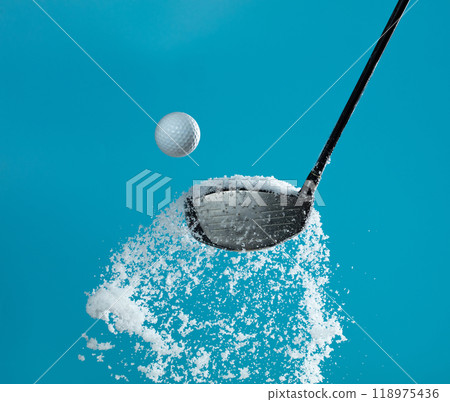 Golf Ball golfer hit snow to explode and splatter. Sand wedge golf dick ball from snow field and snow fly in air. Blue sky background isolated Golf Ball golfer hit snow to explode and splatter. Sand wedge golf dick ball from snow field and snow fly in air. Blue sky background isolated 118975436