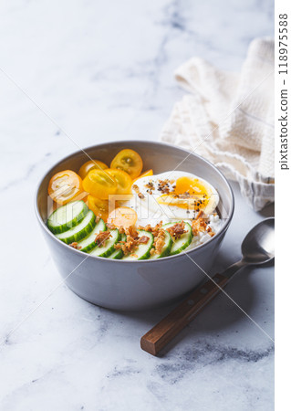 Savory cottage cheese bowl with egg, tomatoes and cucumber. 118975588