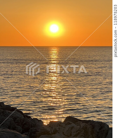Sunset over the Mediterranean sea, seen from the coast in Torremolinos, Andalusia, Spain. Sunset over the Mediterranean sea, seen from the coast in Torremolinos, Andalusia, Spain. 118978203