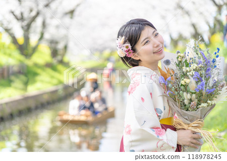 Female university student at graduation ceremony Female university student at graduation ceremony 118978245