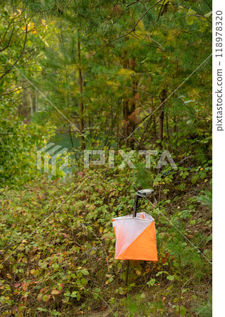 Orienteering. Control point Prism and electric composter for orienteering in the spring forest. 118978320