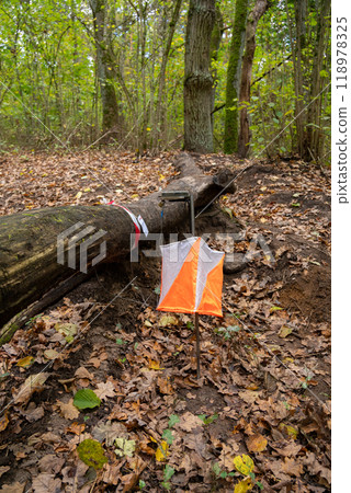 Orienteering. Control point Prism and electric composter for orienteering in the spring forest. 118978325