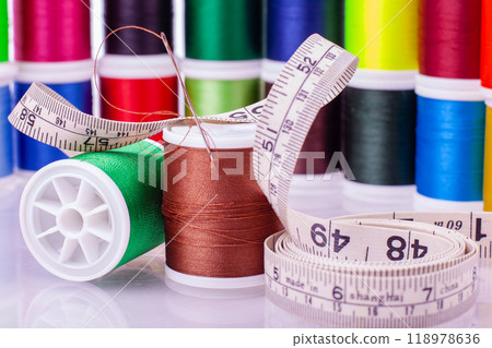 Sewing supplies with colorful thread and measuring tape Sewing supplies with colorful thread and measuring tape 118978636