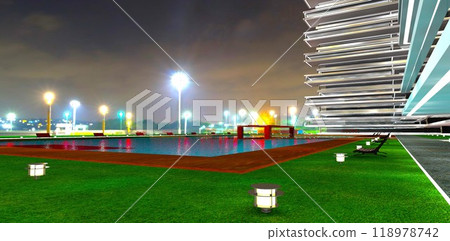 View from the courtyard of a modern condominium with a pool and lawn lamps towards the distant lights of the night city. 3D rendering. 118978742