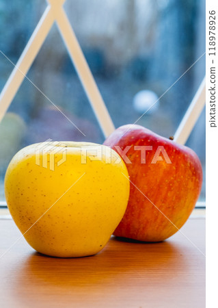 Japanese yellow and red apples close-up on table Japanese yellow and red apples close-up on table 118978926