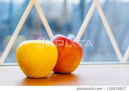 Japanese yellow and red apples close-up on table Japanese yellow and red apples close-up on table 118978927
