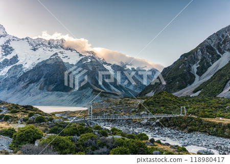 View of suspension bridge with mountain range on Hooker Valley Track in national park at New Zealand 118980417