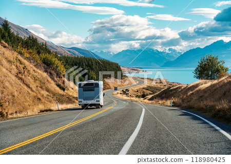 Road trip with motorhome driving on road and Mount Cook by Lake Pukaki at Peters lookout, New Zealand 118980425