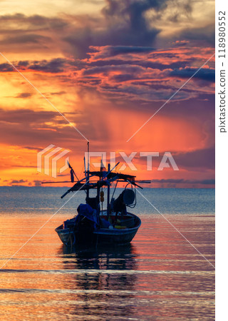 Colorful sunrise sky over fishing boat in tropical sea 118980552