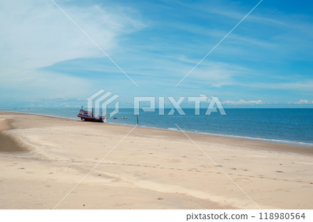 White beach with traditional boat in tropical sea in sunny day 118980564