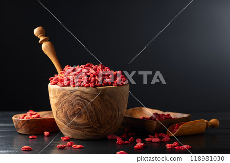 Dried goji berries on a black background. 118981030