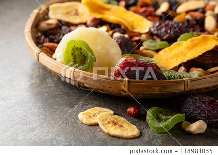 Dried tropical fruits with various nuts and raisins. 118981035