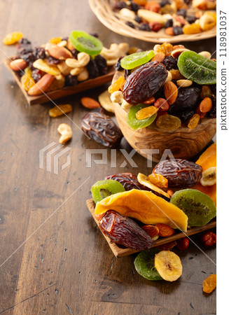 Dried tropical fruits with various nuts and raisins. Dried tropical fruits with various nuts and raisins. 118981037