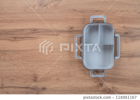 Empty lunch box on a wooden background. top view. copy space Empty lunch box on a wooden background. top view. copy space 118981167