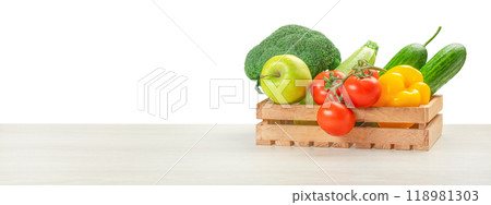 Fresh vegetables, fruits, food in a wooden box on table isolated on white. food delivery concept Fresh vegetables, fruits, food in a wooden box on table isolated on white. food delivery concept 118981303