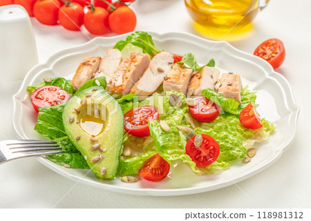 Healthy salad with grilled chicken, tomato, avocado, lettuce. Healthy and detox food concept. Ketogenic diet 118981312