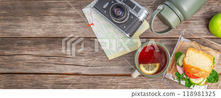 Road trip Healthy lunch box with Cup of tea and apple. snack food travel 118981325