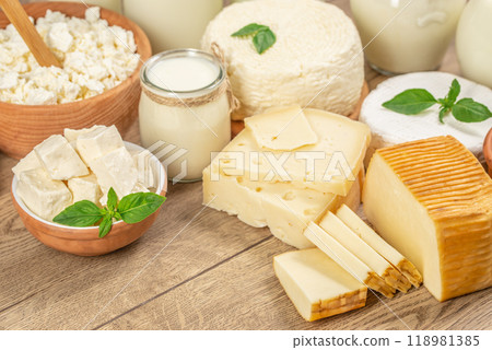 Natural dairy products. cottage cheese, milk on a wooden background. top view Natural dairy products. cottage cheese, milk on a wooden background. top view 118981385