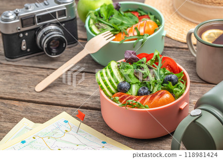 Healthy lunch box, food for the trip, snacks outside the tent at campsite, picnic, Outdoors activity, camping, hiking, trekking tourism concept Healthy lunch box, food for the trip, snacks outside the tent at campsite, picnic, Outdoors activity, camping, hiking, trekking tourism concept 118981424