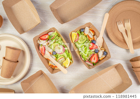 salad with chicken and vegetables served in recyclable containers. Eco friendly disposable dishes 118981445