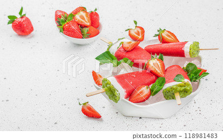 Strawberry ice cream popsicles in shape of watermelon in bowl on a white background top view. copy space 118981483
