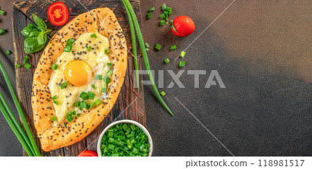 Fresh delicious Adjarian khachapuri, traditional dish of Georgian cuisine Fresh delicious Adjarian khachapuri, traditional dish of Georgian cuisine 118981517