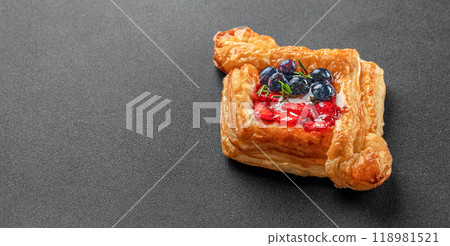 Delicious puff pastry with berries on a dark background. banner, menu, recipe place for text, top view 118981521