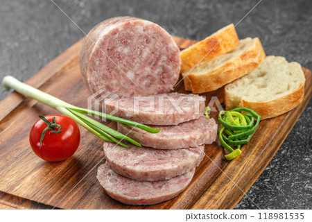 Headcheese chopped. pork meat product on a wooden board, top view. copy space 118981535