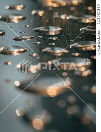 Close up of Rain water drops on the metallic surface. Water droplets caused by rain perched on a stainless steel handle, 118981559