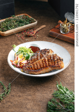 Portion of grilled beef t bone steak Portion of grilled beef t bone steak 118981792
