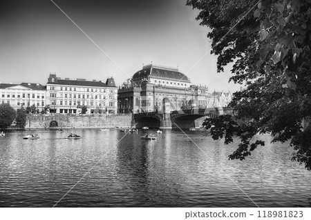 Tourists enjoying paddle boats with the National Theatre in Prague Tourists enjoying paddle boats with the National Theatre in Prague 118981823