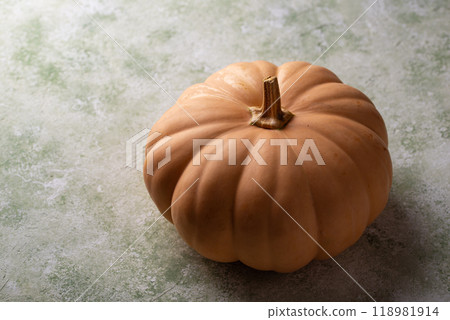 Raw fresh cut pumpkin on dark background 118981914