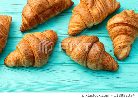 Group of sweet croissant . French morning breakfast . Top view Group of sweet croissant . French morning breakfast . Top view 118982354