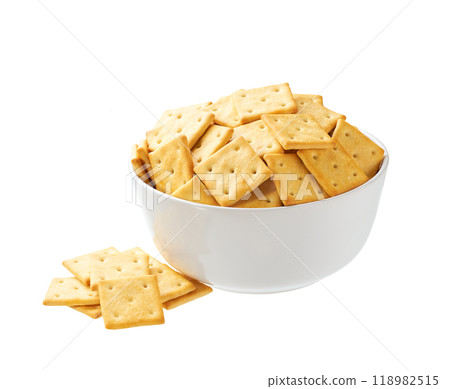 Square crackers in a ceramic bowl isolated on white background. Square crackers in a ceramic bowl isolated on white background. 118982515