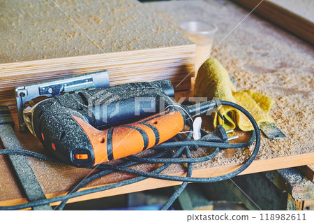 Heating industrial dryer gun tool, wood plywood sheets and sawdust 118982611