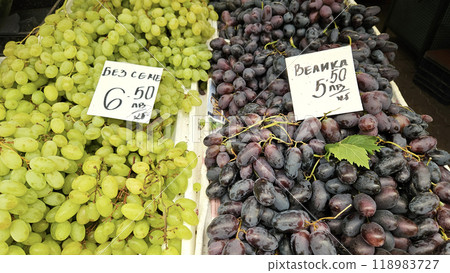 Ripe grape of different varieties on a counter at a market in Bulgaria Ripe grape of different varieties on a counter at a market in Bulgaria 118983727