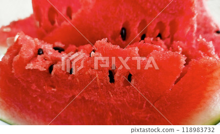 Pieces of ripe juicy red watermelon close-up on white background 118983732