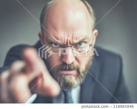 Angry businessman pointing his finger at you 118983846