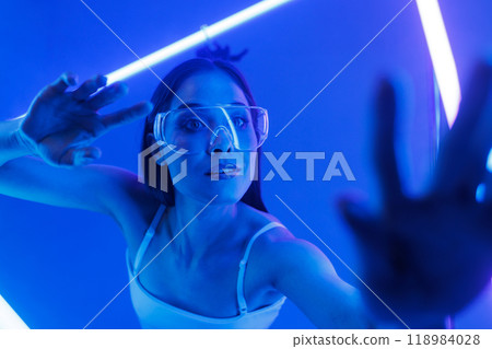 virtual girl in transparent glasses in a futuristic space surrounded by neon lights, cyberspace 118984028