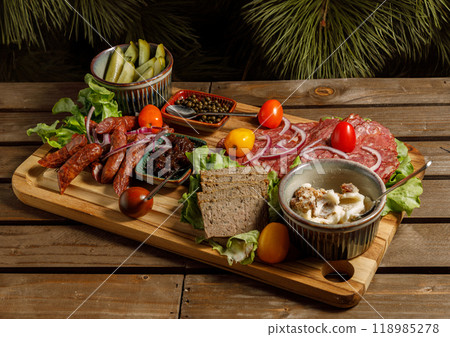 Artisan Charcuterie Board with a variety of delightful treats and fresh vegetable colors Artisan Charcuterie Board with a variety of delightful treats and fresh vegetable colors 118985278