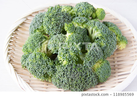 Cut broccoli in a colander 118985569