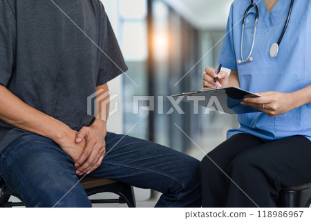 Male doctor and testicular cancer patient discuss the test results. Testicular cancer and prostate cancer concept. Male doctor and testicular cancer patient discuss the test results. Testicular cancer and prostate cancer concept. 118986967