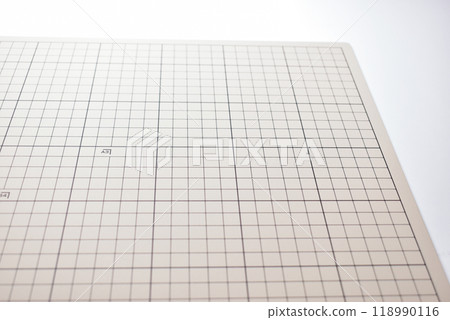 gray cutting mat board on white background with line and scale measure guide pattern 118990116
