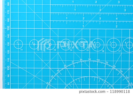blue cutting mat board on white background with line and scale measure guide pattern 118990118