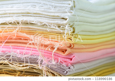 stack of colourful cotton clothes, close up pile of clothing stack of colourful cotton clothes, close up pile of clothing 118990186