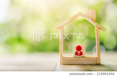 Wooden model house place on the table. Real estate brokerage manager symbol, concept of real estate investment. planning savings money of coins to buy a home concept for property. Wooden model house place on the table. Real estate brokerage manager symbol, concept of real estate investment. planning savings money of coins to buy a home concept for property. 118991048