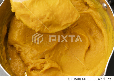 Pumpkin potage: Add milk and consommé to the pumpkin Pumpkin potage: Add milk and consommé to the pumpkin 118991066