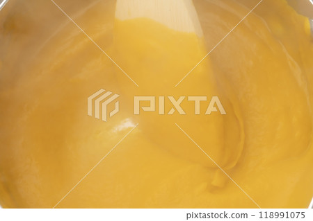 Pumpkin potage: Add milk and consommé to the pumpkin 118991075